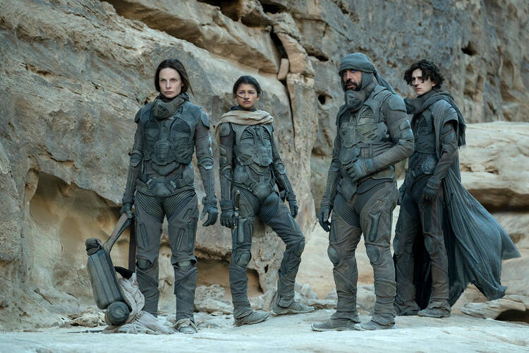 Rebecca Ferguson as Lady Jessica Atreides, from left, Zendaya as Chani, Javier Bardem as Stilgar, and Timothée Chalamet as Paul Atreides in "Dune." Photo by Chiabella James/© 2020 Warner Bros. Entertainment Inc.