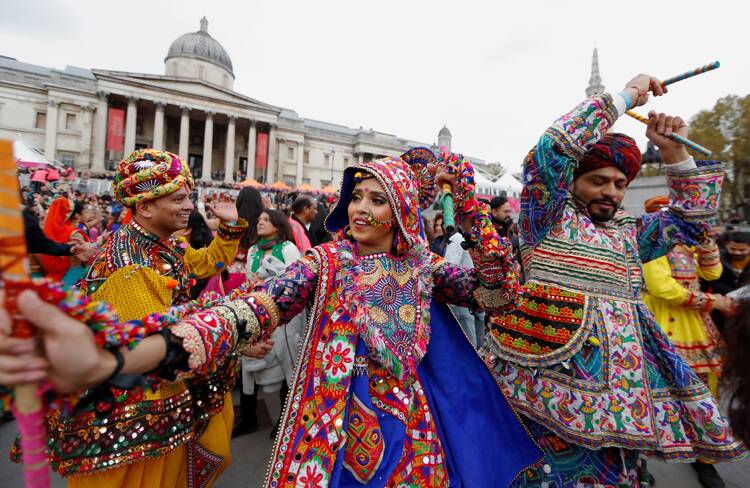 Dancers in an array of bright colors perform a Ghoomar dance during Diwali celebrations in Trafalgar Square in London Nov. 3, 2019.