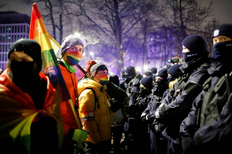 Demonstrators confront law enforcement officers during a protest in Warsaw, Poland, Jan. 28, 2021, against the verdict restricting abortion rights. After a ban on aborting disabled children came into force, Poland's Catholic Church urged "all possible help" for pregnant women and single mothers. (CNS photo/Kacper Pempel, Reuters)