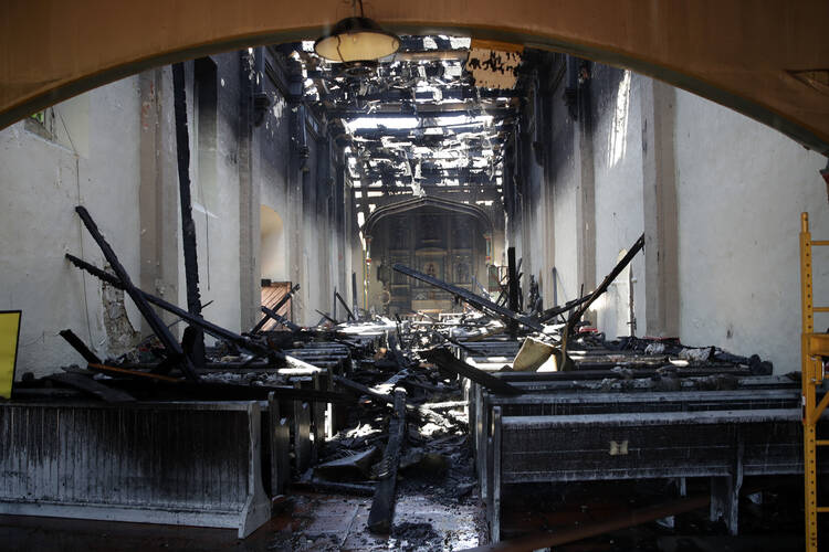 The charred interior of the San Gabriel Mission is damaged following a morning fire in San Gabriel, Calif, July 11, 2020.