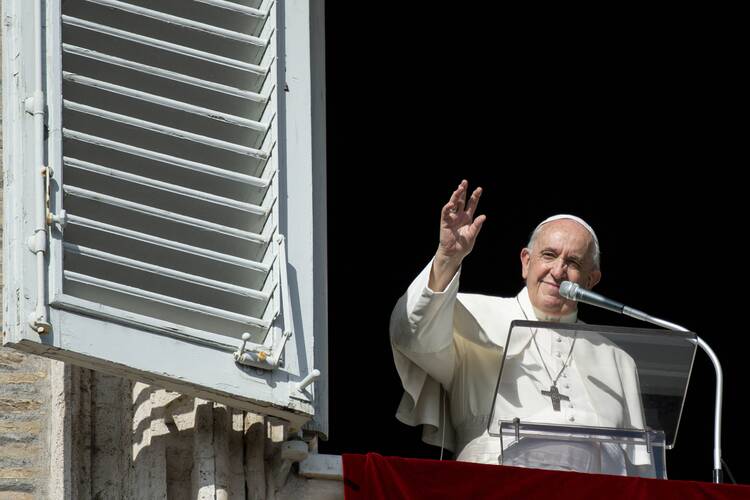 Pope Francis, seen here at the window of his studio overlooking St. Peter's Square, received a copy of Hidden Mercy: AIDS, Catholics, and the Untold Stories of Compassion in the Face of Fear this summer. (CNS photo/Vatican Media)