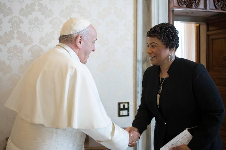 Pope Francis shakes hands with Bernice King, daughter of civil rights leader Martin Luther King Jr., during a private audience at the Vatican.