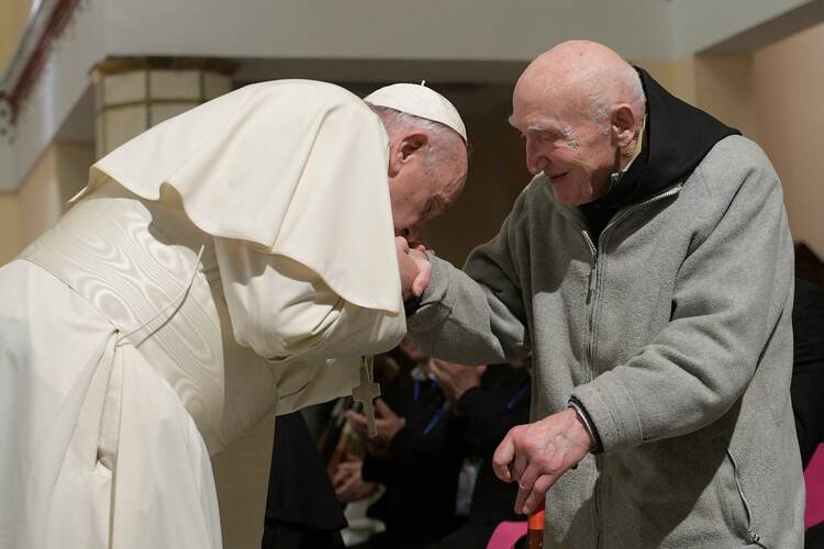 In this photo Pope Francis kisses Trappist Father Jean-Pierre Schumacher’s hand during a meeting at the cathedral in Rabat, Morocco, March 31, 2019.