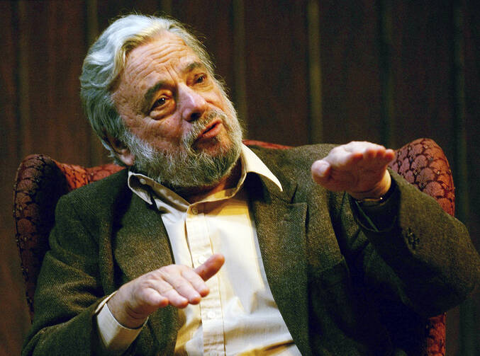 Composer and lyricist Stephen Sondheim gestures during a gathering at Tufts University in Medford, Mass., on April 12, 2004. Sondheim, the songwriter who reshaped the American musical theater in the second half of the 20th century, has died at age 91. (AP Photo/Charles Krupa, File)