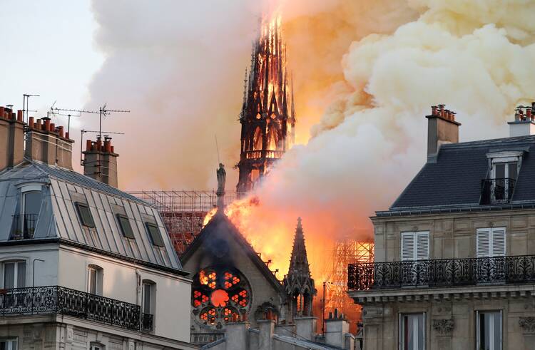 Flames and smoke billow from the Notre-Dame Cathedral after a fire broke out in Paris on April 15, 2019.