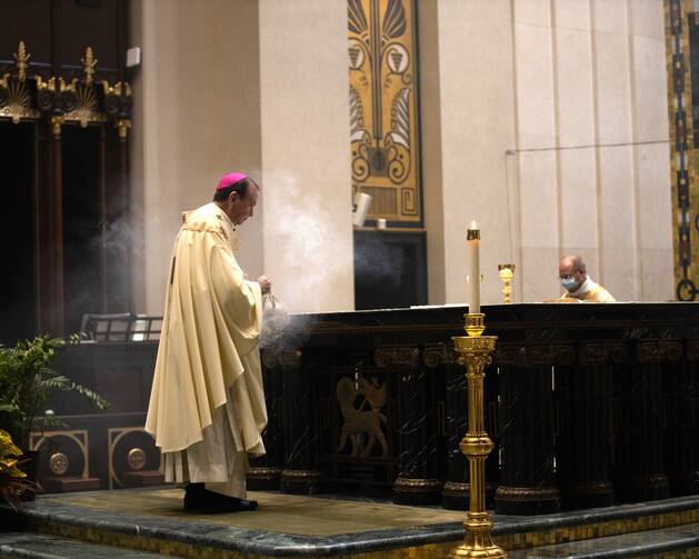 Archbishop Dennis M. Schnurr of Cincinnati celebrates Mass at the Cathedral Basilica of St. Peter in Chains in Cincinnati Aug. 15, 2020.