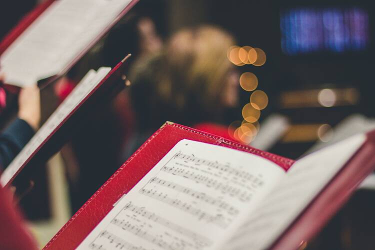 a hymnal is open at a candlelit church service