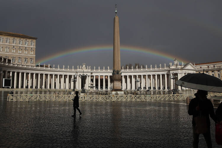 A rainbow shines over St. Peter’s Square at the Vatican.