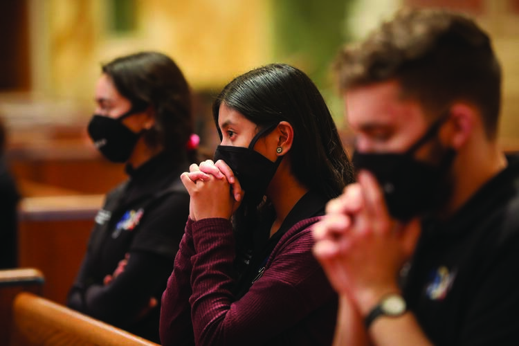 Members of the Archdiocese of Washington Youth Leadership Team pray during Mass for Life at the Cathedral of St. Matthew the Apostle in Washington on Jan. 29. (CNS photo/Andrew Biraj, Catholic Standard)