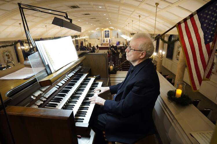 James Kendall plays the organ during an "Advent Lessons and Carols" service on the first Sunday of Advent at Our Lady of Perpetual Help Church in Lindenhurst, N.Y., on Nov. 28, 2021. (CNS photo/Gregory A. Shemitz)