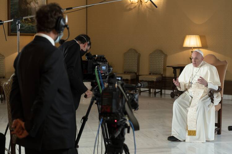 Pope Francis films the TV show “Stories of a Generation With Pope Francis,” streaming Dec. 25, 2021, on Netflix.