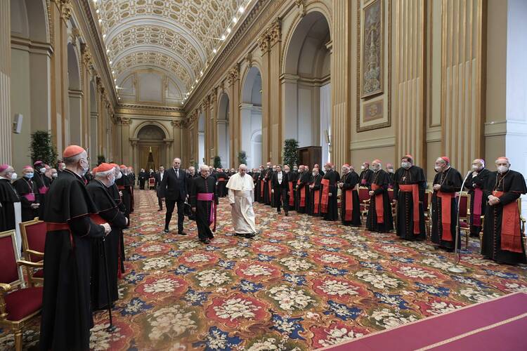Pope Francis arrives for an audience to exchange Christmas greetings with members of the Roman Curia in the Apostolic Palace at the Vatican Dec. 23, 2021. (CNS photo/Vatican Media)
