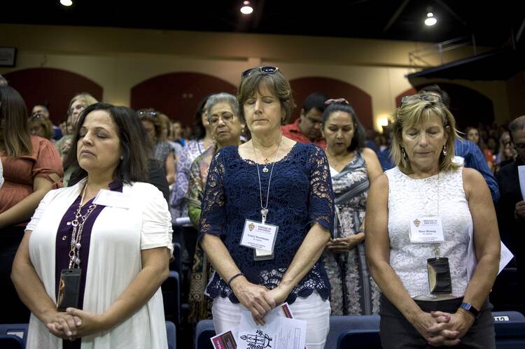 Women pray during an Aug. 13, 2019, meeting led by San Diego Bishop Robert W. McElroy in response to Pope Francis' call to confront sexual abuse of minors and other vulnerable people. (CNS photo/David Maung)