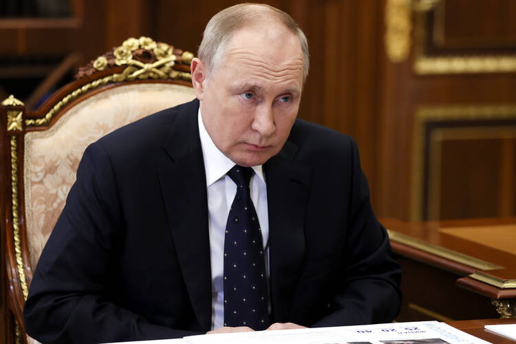 In this Jan. 18, 2022, photo, Russian President Vladimir Putin listens during a meeting in the Kremlin, in Moscow. (Mikhail Metzel, Sputnik, Kremlin Pool Photo via AP)