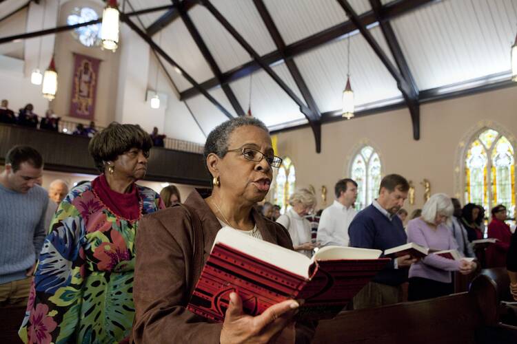 Joanne Pereira sings the closing hymn during Sunday Mass at St. Joseph's Catholic Church in Alexandria, Va., on Nov. 27, 2011. (CNS photo/Nancy Phelan Wiechec)