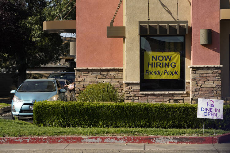 A hiring sign hangs in the window of a Taco Bell in Sacramento, Calif. on July 15, 2021. The Covid-19 pandemic’s “Great Resignation” has shown that workers have more power than they had realized. (AP Photo/Rich Pedroncelli, File)
