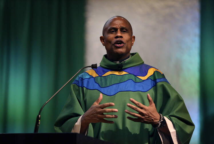 The Rev. Bryan Massingale gives a sermon on Sunday, Jan. 30, 2022, at St. Charles Borromeo Catholic Church in the Harlem neighborhood of New York.