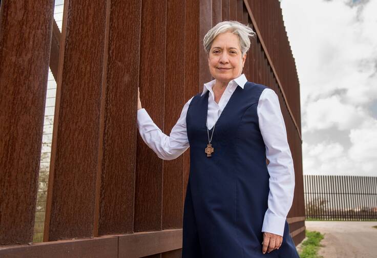 Sister Norma Pimentel, a member of the Missionaries of Jesus, is pictured along a border wall between Texas and Mexico in late February 2018. (CNS photo/Barbara Johnston, courtesy University of Notre Dame)
