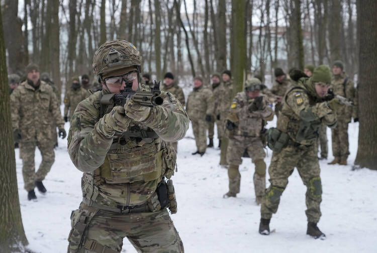 Members of Ukraine's Territorial Defense Forces, volunteer military units of the Armed Forces, train in a city park in Kyiv, Ukraine, on Jan. 22, 2022. (AP Photo/Efrem Lukatsky, File)