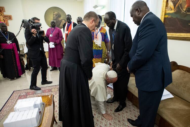 Pope Francis knelt at the feet of South Sudanese President Salva Kiir at the conclusion of a two-day retreat at the Vatican for African nation's political leaders, April 11, 2019.