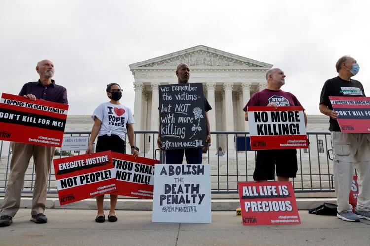 Demonstrators in Washington rally against the death penalty outside the U.S. Supreme Court building Oct. 13, 2021.