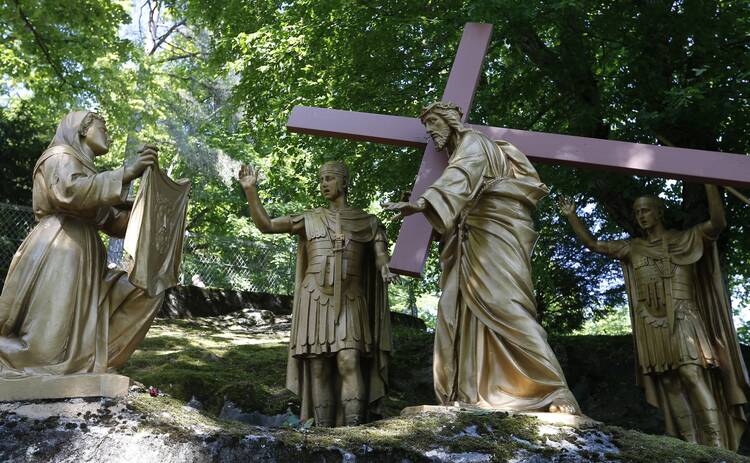 Veronica wipes the face of Jesus in this representation of the sixth Station of Cross at the Shrine of Our Lady of Lourdes in southwestern France.