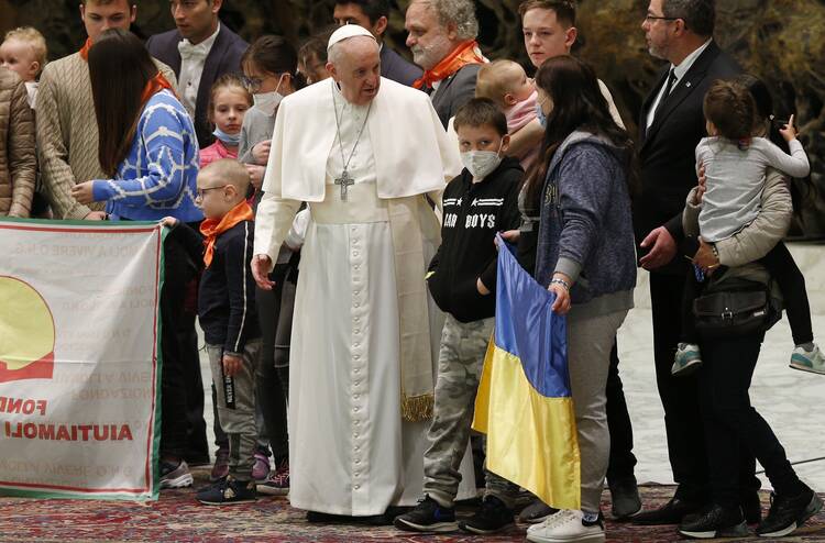 Pope Francis meets young people from Ukraine during his general audience in the Paul VI hall at the Vatican March 30, 2022.