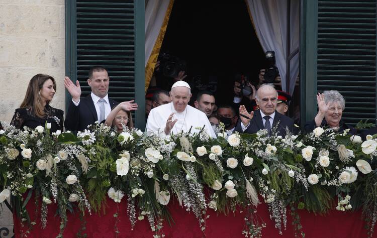 Pope Francis, accompanied by Maltese President George Vella, greets the crowd gathered outside The Palace in Valletta, Malta, April 2, 2022. (CNS photo/Paul Haring)