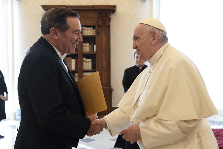Pope Francis greets Joe Donnelly, new U.S. ambassador to the Holy See, during a meeting for the ambassador to present his letters of credential, at the Vatican April 11, 2022.
