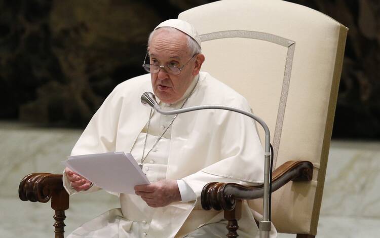 Pope Francis speaks during his general audience in the Paul VI hall at the Vatican April 13, 2022.