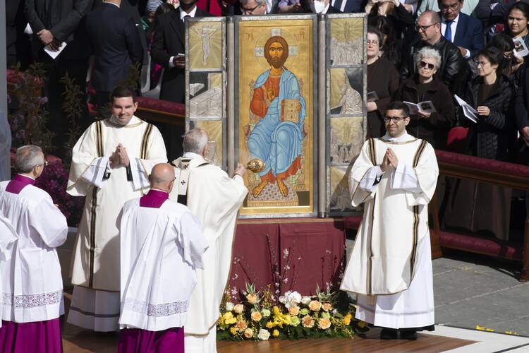 Pope Francis burns incense as he venerates an icon of the risen Jesus during Easter Mass in St. Peter's Square at the Vatican April 17, 2022. (CNS photo/Vatican Media)