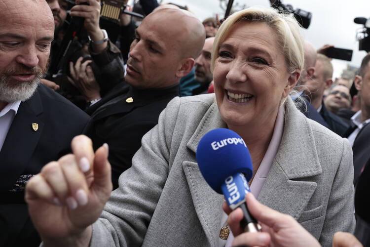 French far-right leader Marine Le Pen arrives at a campaign stop on April 18, 2022, in Saint-Pierre-en-Auge, Normandy. Ms. Le Pen finished strongly with younger voters in the April 10 preliminary election. (AP Photo/Jeremias Gonzalez)