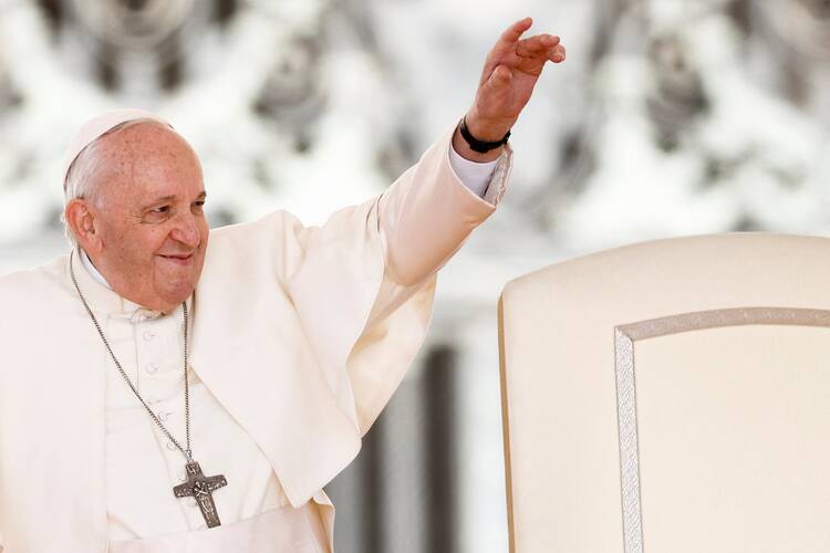 Pope Francis greets the crowd during his general audience in St. Peter's Square at the Vatican April 27, 2022.