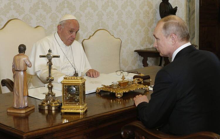 Pope Francis greets Russian President Vladimir Putin during a private audience at the Vatican in this July 4, 2019, file photo. (CNS photo/Paul Haring)