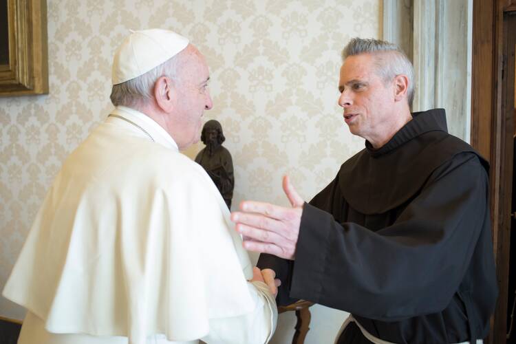 Pope Francis greets Father Michael Perry, then-minister general of the Order of Friars Minor, during a meeting with the superiors of the four main men's branches of the Franciscan family at the Vatican in this April 10, 2017, file photo. (CNS photo/Vatican Media)