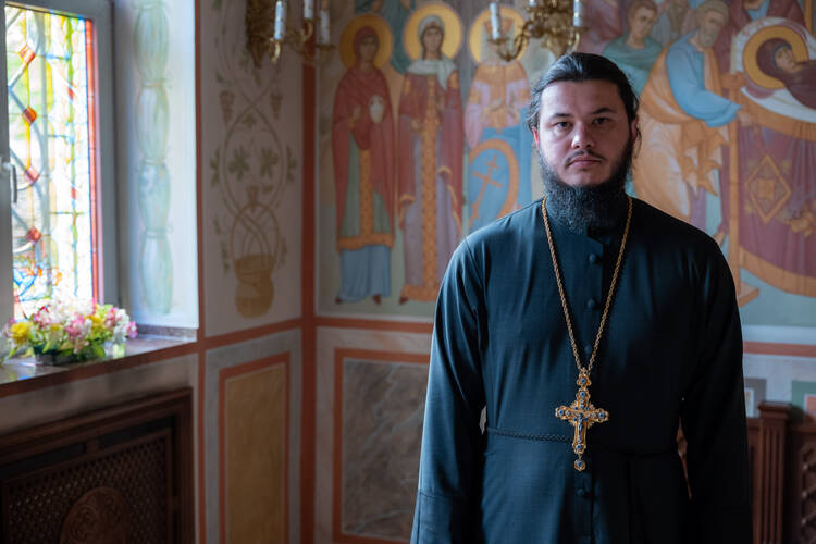 Archpriest Maximian Pogorelovskiy inside Holy Martyrs Adrian and Natalia church in Odesa. Photo by Matthieu de La Rochefoucauld.
