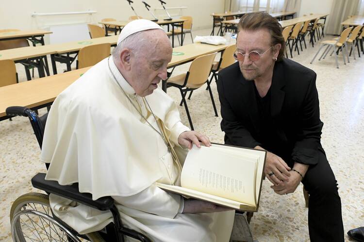 Pope Francis talks climate change with Bono and both agree: Women will lead the way.