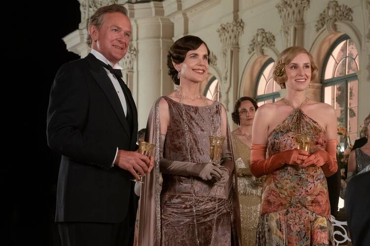 Elizabeth McGovern, center, and Laura Carmichael, right, star in a scene from the movie "Downton Abbey: A New Era." (CNS photo/Ben Blackall, Focus Features)