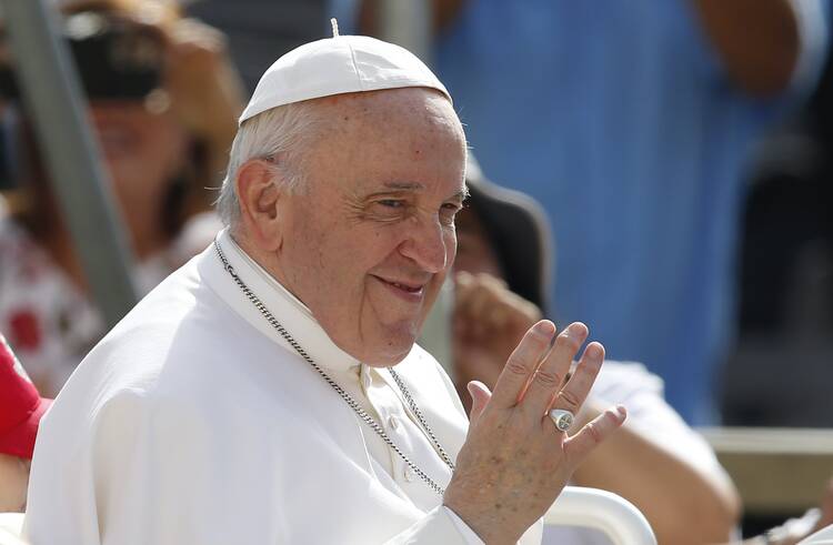 Pope Francis greets the crowd during his general audience in St. Peter’s Square at the Vatican June 22, 2022.