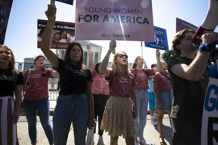 Pro-life demonstrators are seen near the Supreme Court in Washington June 15, 2022.