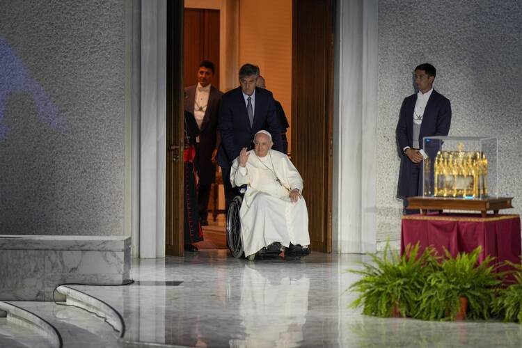 Pope Francis arrives to attend the Festival of Families in the Paul VI Hall at the Vatican, on the first day of the World Meeting of Families, Wednesday, June 22, 2022. (AP Photo/Andrew Medichini)