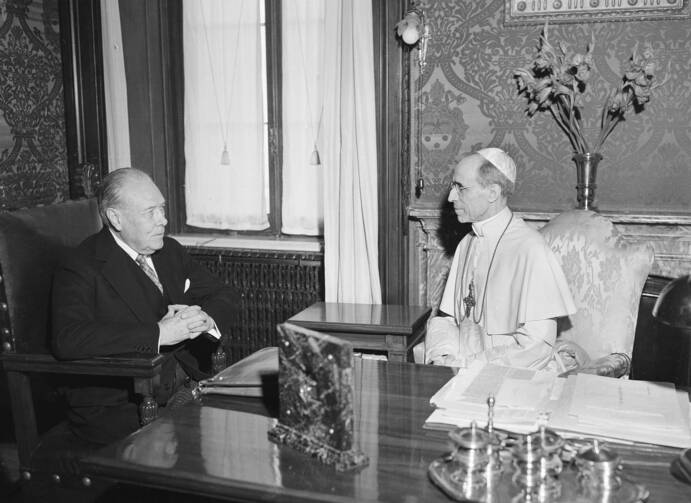 President Truman's envoy to the Vatican, Myron C. Taylor, left, has an audience with Pope Pius XII at Castelgandolfo near Rome, on Aug. 26, 1947. (AP Photo/Luigi Felici, File)