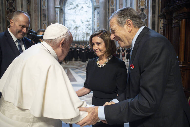 Pope Francis, greets Speaker of the House Nancy Pelosi, D-Calif., and her husband, Paul Pelosi before celebrating a Mass on the Solemnity of Saints Peter and Paul, in St. Peter's Basilica at the Vatican, Wednesday, June 29, 2022. Pelosi met with Pope Francis on Wednesday and received Communion during a papal Mass in St. Peter's Basilica, witnesses said, despite her position in support of abortion rights. (Vatican Media via AP)