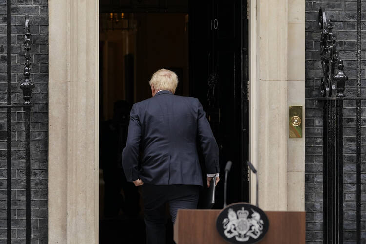 Prime Minister Boris Johnson enters 10 Downing Street, after his reading a resignation statement in London, July 7 (AP Photo/Alberto Pezzali, file).