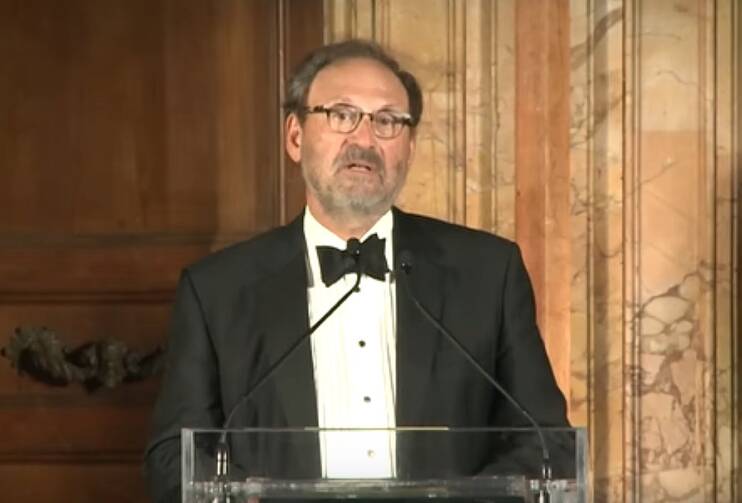 Justice Samuel Alito, dressed in a tuxedo, speaks at a podium