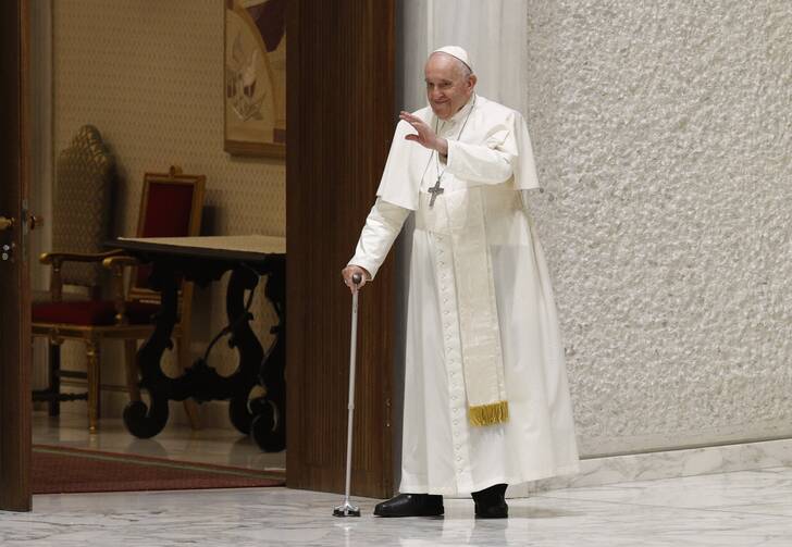 Pope Francis greets the crowd as he arrives for his general audience in the Paul VI hall at the Vatican Aug. 3, 2022. (CNS photo/Paul Haring)