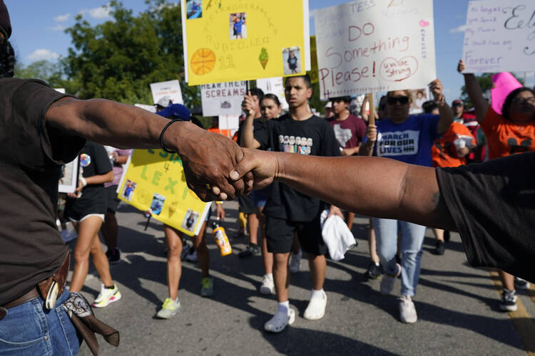 Escorted by the Texas Brown Berets, family and friends of those killed and injured in the school shootings at Robb Elementary take part in a protest march and rally on Sunday, July 10, 2022, in Uvalde, Texas. (AP Photo/Eric Gay)