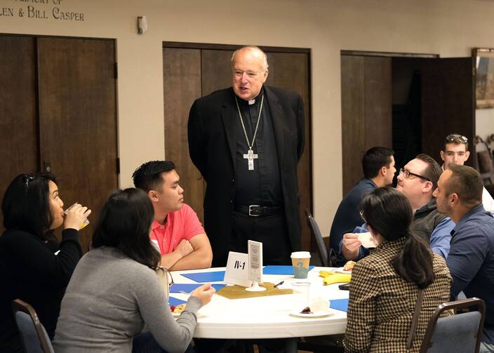 Bishop Robert W. McElroy of San Diego chats with participants in the closing session of the San Diego Diocese's synod on young adults at Mission San Diego de Alcalá on Nov. 9, 2019. He was among 21 new cardinals named by Pope Francis May 29, 2022. (CNS photo/David Maung, Diocese of San Diego)