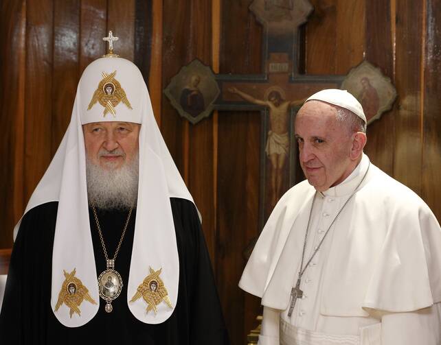 Russian Orthodox Patriarch Kirill of Moscow and Pope Francis pose for photos at the beginning of their meeting at Jose Marti International Airport in Havana.