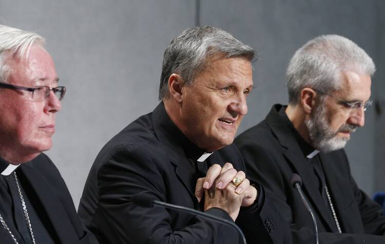 Cardinal Mario Grech speaks during a news conference